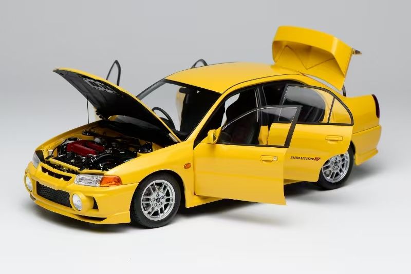 MOTORHELIX 1:18 Mitsubishi Lancer Evolution IV - Dandelion Yellow