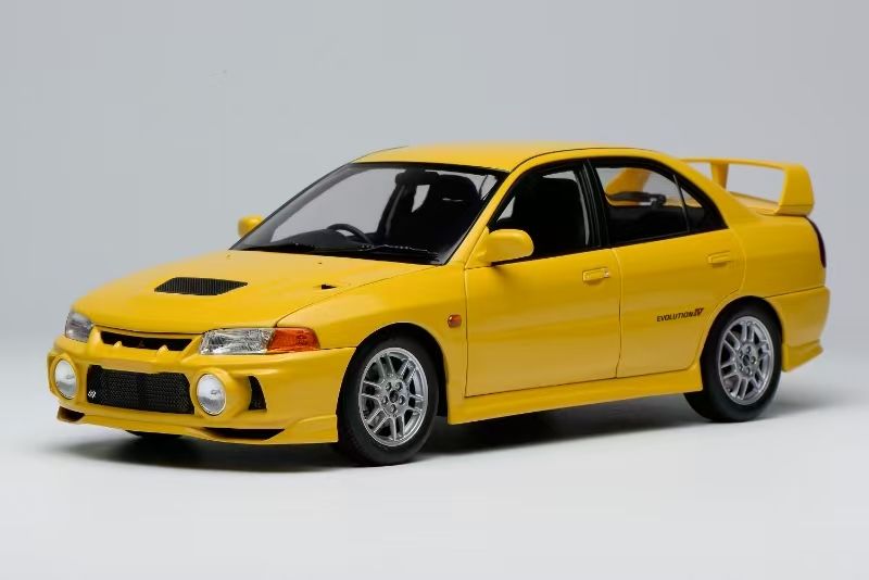 MOTORHELIX 1:18 Mitsubishi Lancer Evolution IV - Dandelion Yellow
