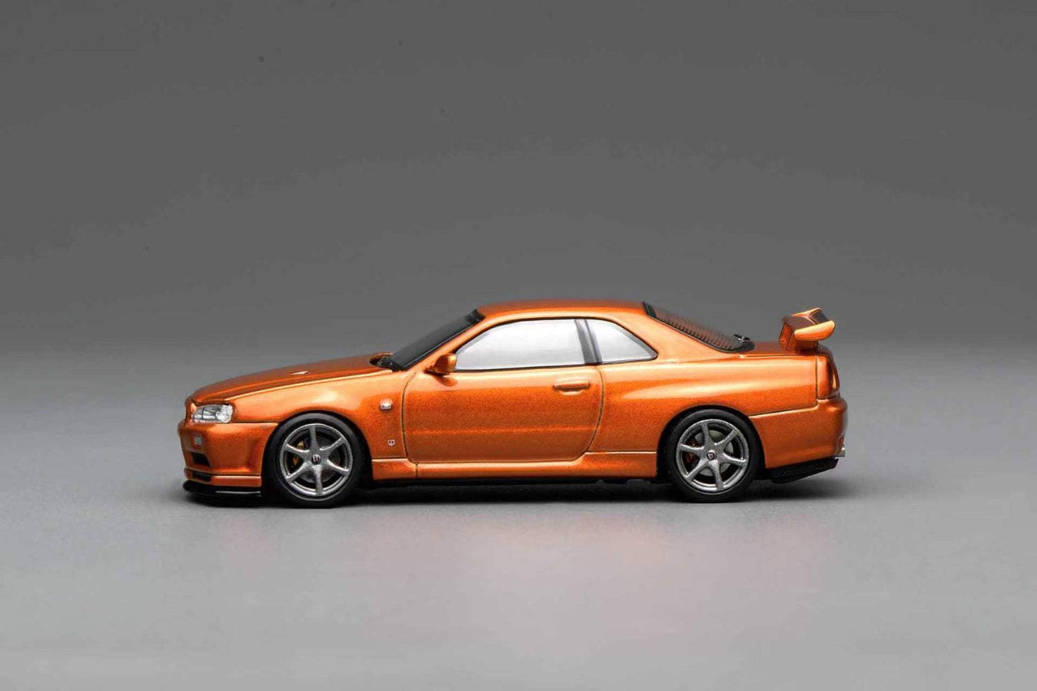 *PREORDER* MotorHelix 1:64 Nissan Skyline GT-R (R34) V-Spec Customized in Metallic Orange