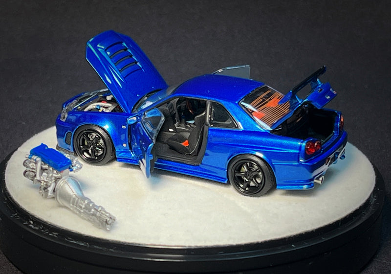 PGM 1:64 Nissan Skyline GT-R (R34) in Bayside Blue Luxury Version