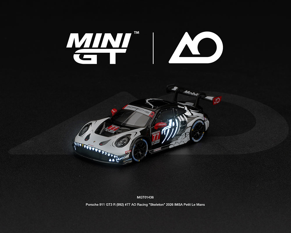 *PREORDER* MINI GT 1:64 Porsche 911 GT3 R (992) #77 AO Racing “Skeleton Rexy” 2026 IMSA Petit Le Mans – (Glow in the Dark)