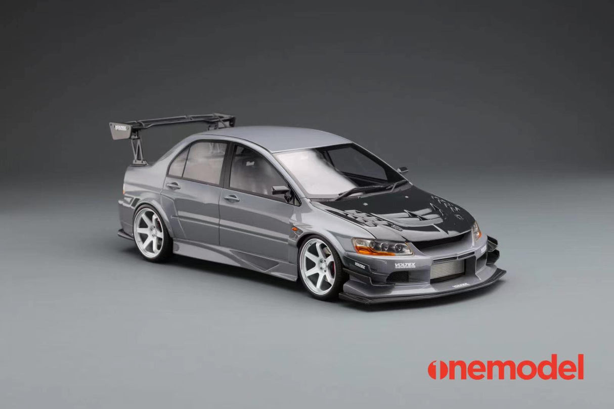 One Model 1:18 Mitsubishi Lancer Evolution IX Voltex with Carbon Bonnet in Iron Gray