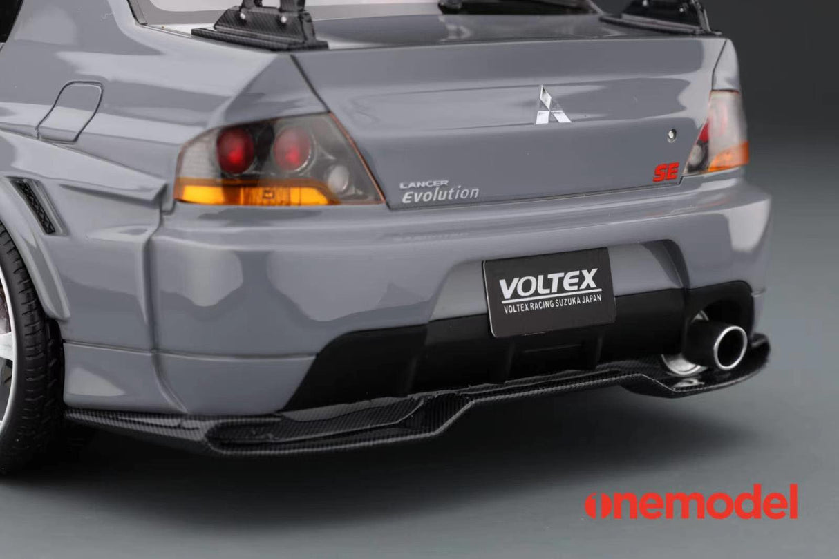 One Model 1:18 Mitsubishi Lancer Evolution IX Voltex with Carbon Bonnet in Iron Gray