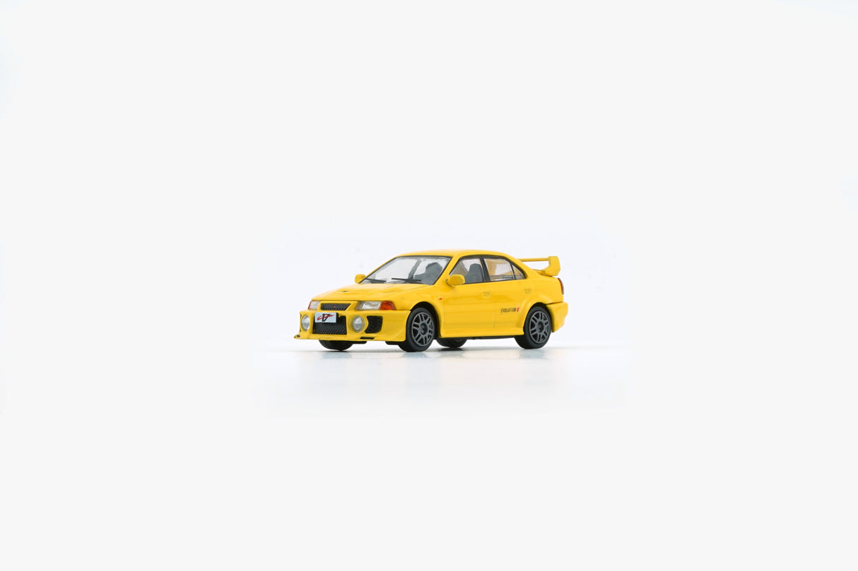 BM Creations 1:64 Mitsubishi Lancer EVO V / VI (RHD) in Yellow