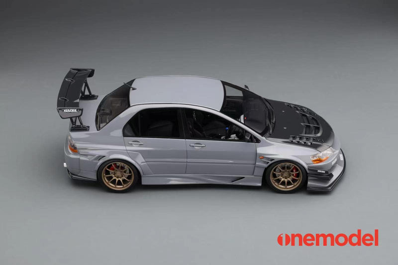 One Model 1:18 Mitsubishi Lancer Evolution IX Voltex with Carbon Bonnet in Iron Gray