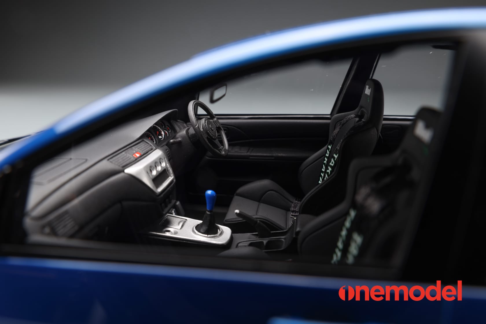One Model 1:18 Mitsubishi Lancer Evolution IX Voltex with Carbon